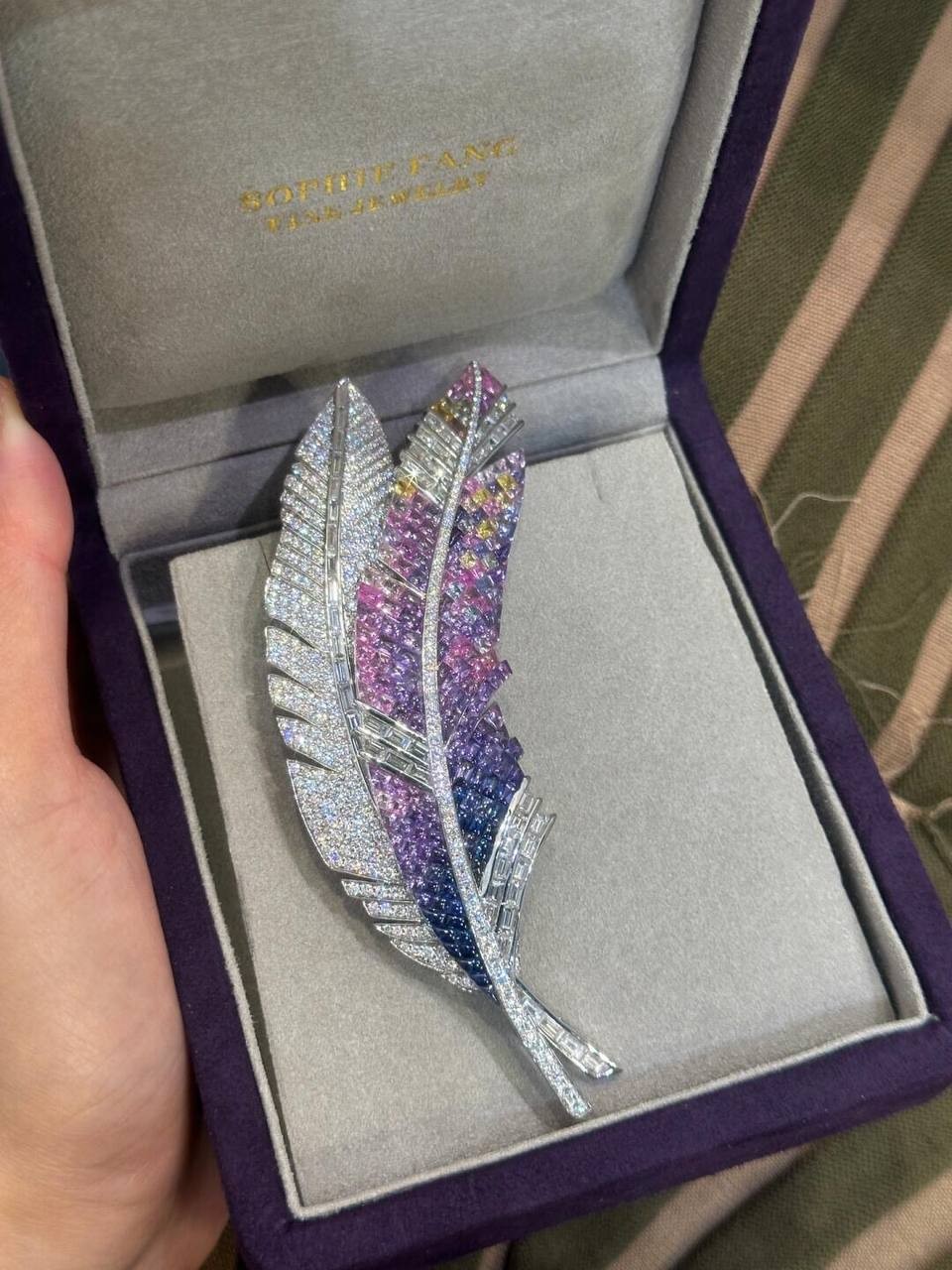 Platinum inlaid blue, purple, pink, yellow sapphire brooch. Length: 4.3cm Width: 2.2cm